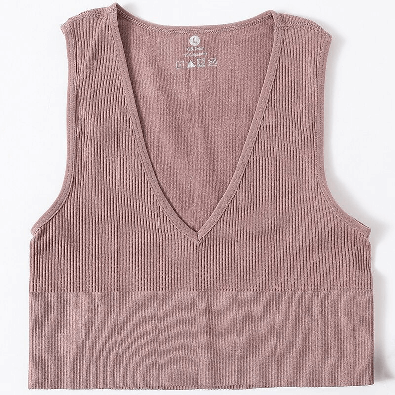 Women's ribbed seamless tank top with deep V-neck in pink; perfect for yoga, running, and dancing; breathable and stretchy material.